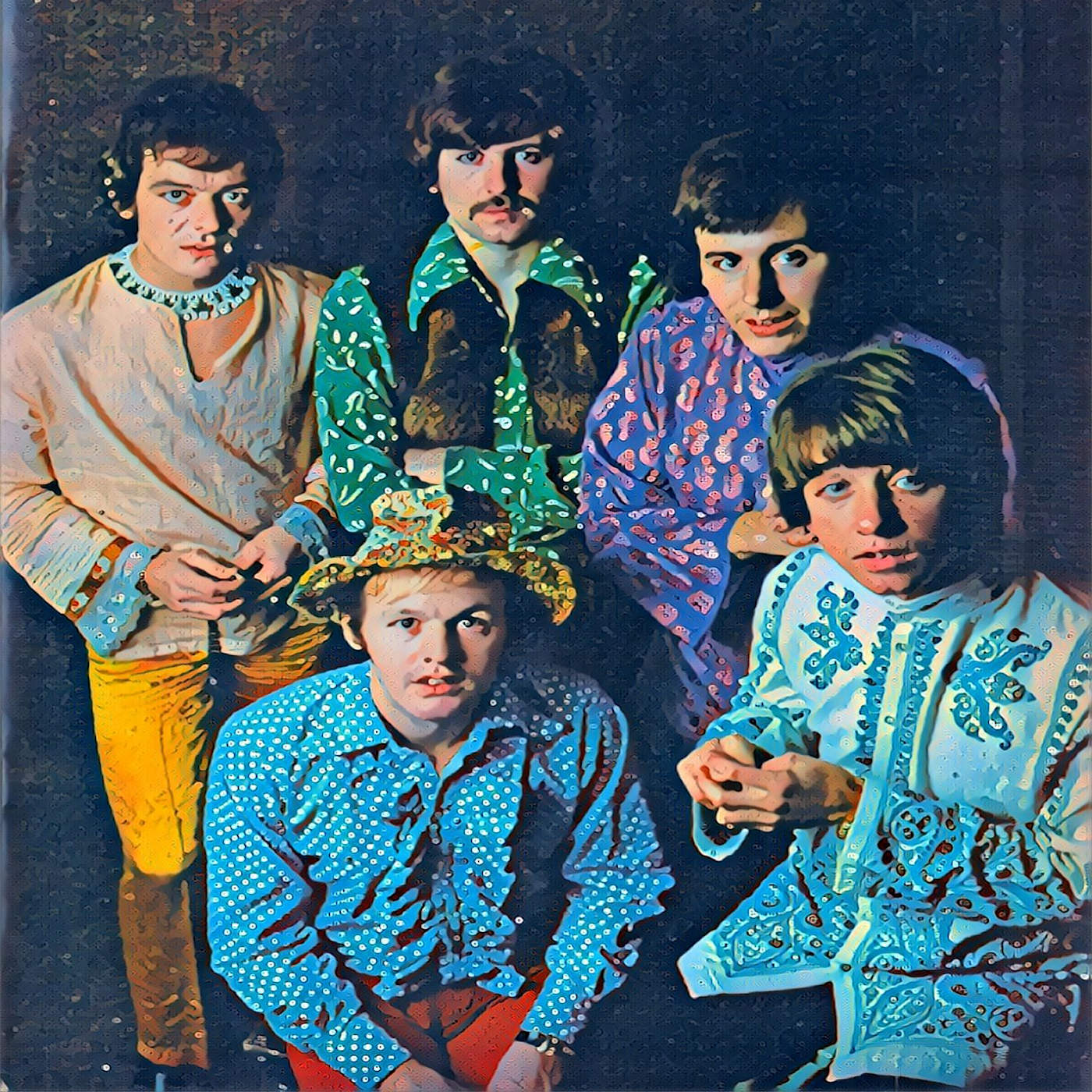 All five members of The Hollies pose for the photographer. They are wearing their psychedelic clothing